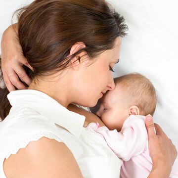 breastfeeding baby with mum